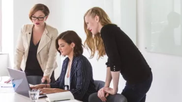 image of female employees at a computer in an office