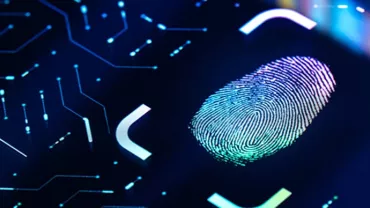 Digital fingerprint on a futuristic screen with circuit patterns.